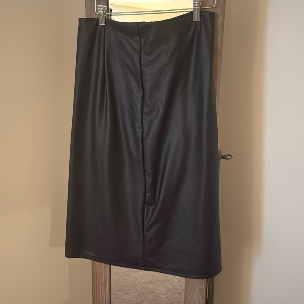 Black faux leather midi skirt- like new. Side slit.